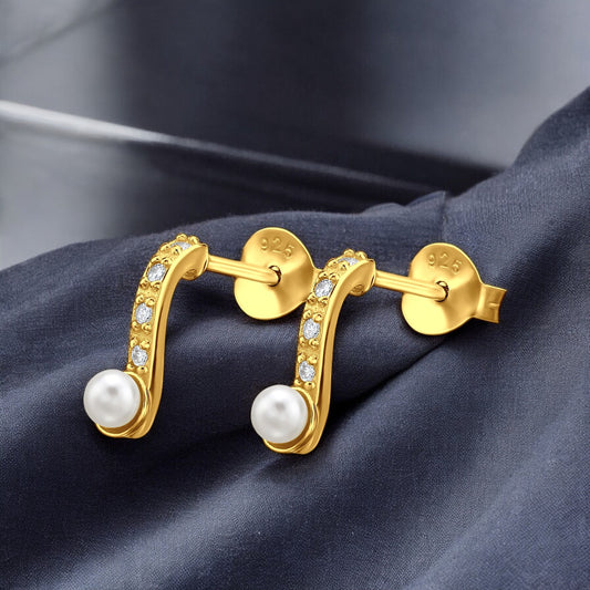Sterling silver curved pearl ear studs by Belumiee with elegant design and shiny pearl accents.