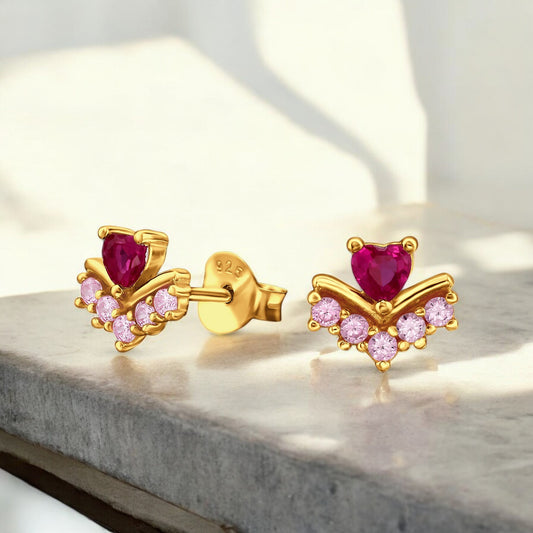 Heart-shaped sterling silver ear studs with pink gemstone accents, stylish Belumiee jewelry for elegant ear piercings.