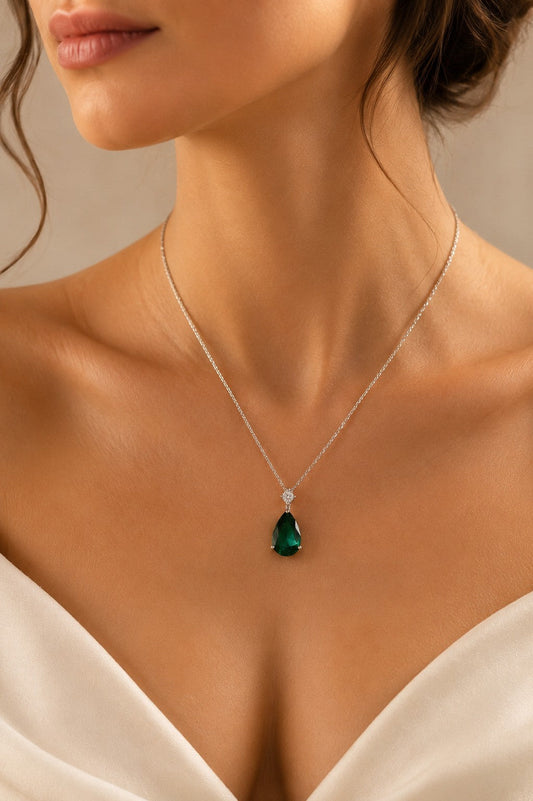 Green teardrop pendant necklace in 925 sterling silver with a sleek design, featuring a polished green gemstone.
