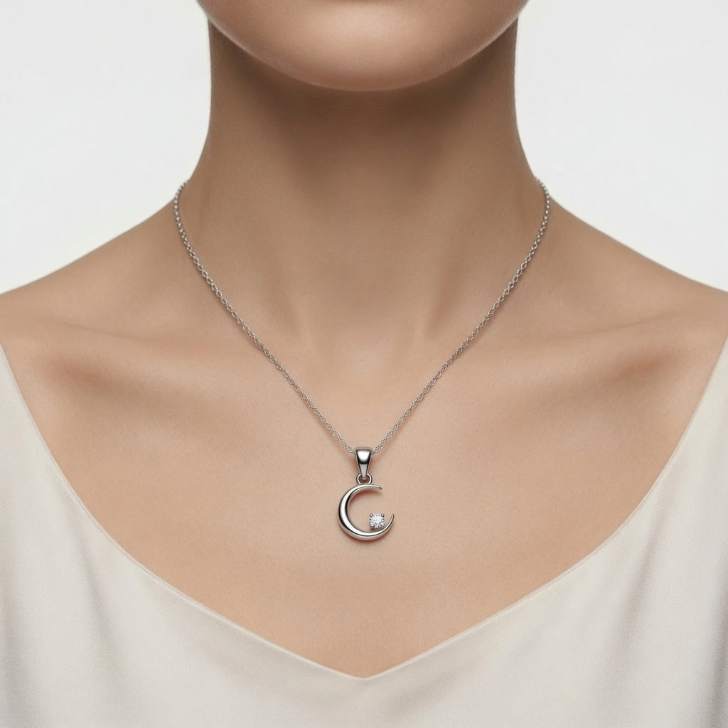 Sterling silver Moon and Star pendant necklace by Belumiee, featuring celestial charms on a delicate chain.