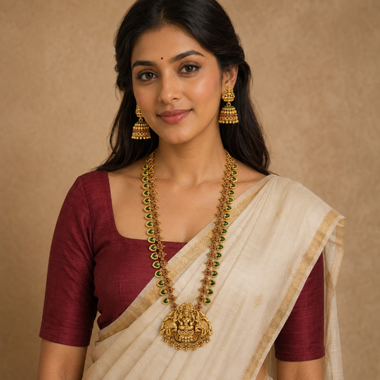 Belumiee Lakshmi Temple long necklace and jhumka set featuring intricate design and traditional gold-tone jewelry.