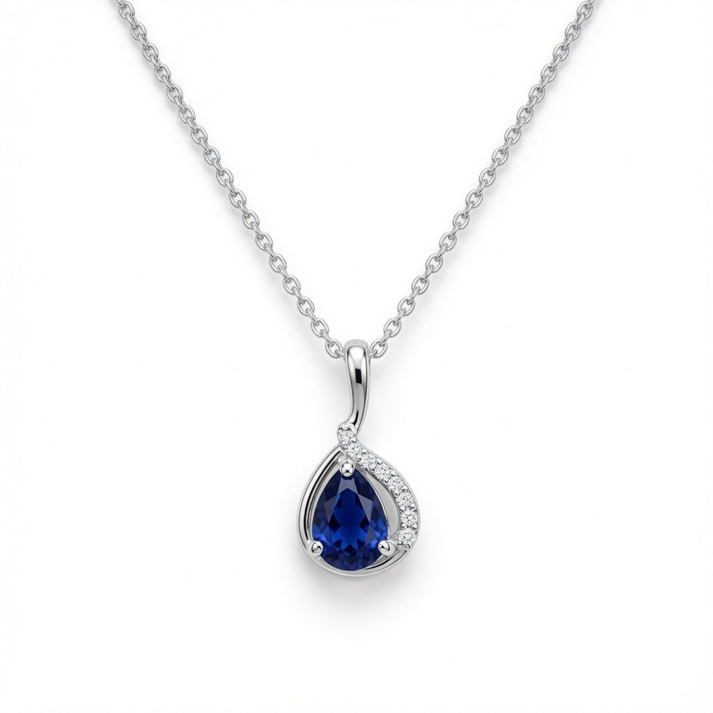 Blue drop pendant necklace in 925 sterling silver featuring a smooth, teardrop-shaped blue gemstone on a delicate chain.