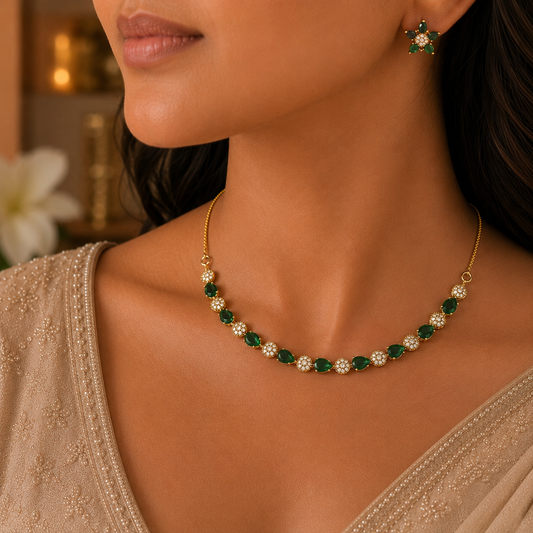 A close-up lifestyle shot of a model wearing a gold necklace with green and white crystal clusters, along with a matching green crystal star-shaped earring.