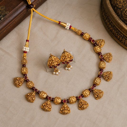 Traditional Lakshmi charm necklace set by Belumiee, featuring intricate Indian imitation jewelry with detailed Lakshmi pendant and matching earrings.