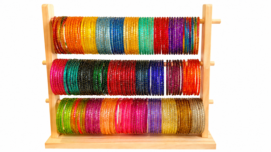 Belumiee Navrang Sparkle Glass Bangles Set featuring shimmering, colorful glass bangles arranged in a decorative display.