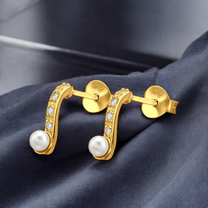 Sterling silver curved pearl ear studs by Belumiee with elegant design and shiny pearl accents.