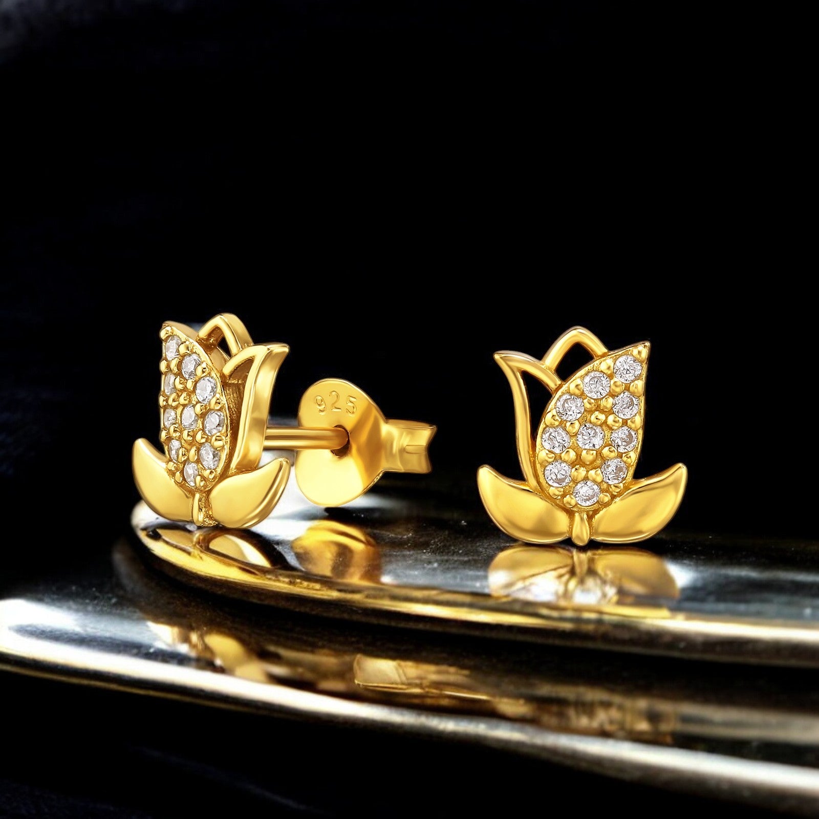 Sterling silver tulip flower ear studs featuring delicate, detailed design, perfect for elegant everyday wear.
