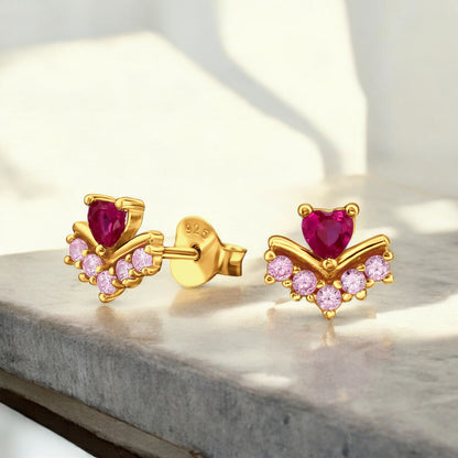 Heart-shaped sterling silver ear studs with pink gemstone accents, stylish Belumiee jewelry for elegant ear piercings.