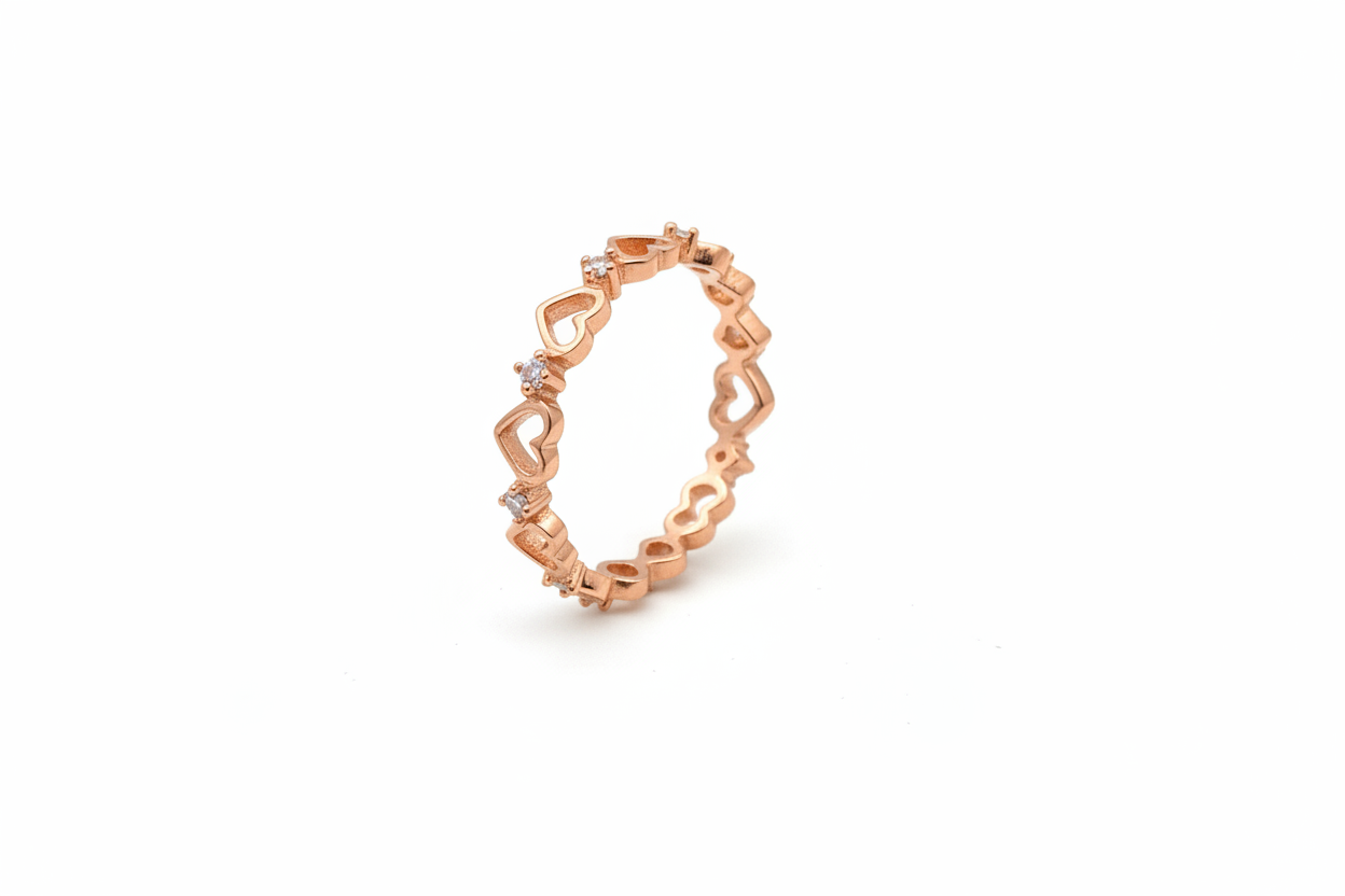 Sterling silver heart eternity ring by Belumiee, featuring a continuous row of heart-shaped designs on a sleek band.