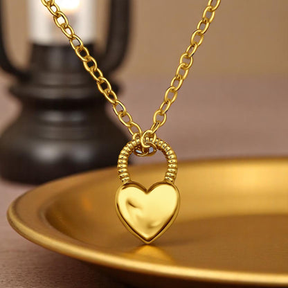 Gold plated heart padlock necklace in 925 sterling silver, featuring a delicate chain and secure clasp.