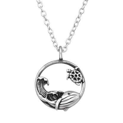 Sterling silver whale, sea turtle, and wave necklace by Belumiee, featuring detailed ocean-themed pendant on a 45cm chain