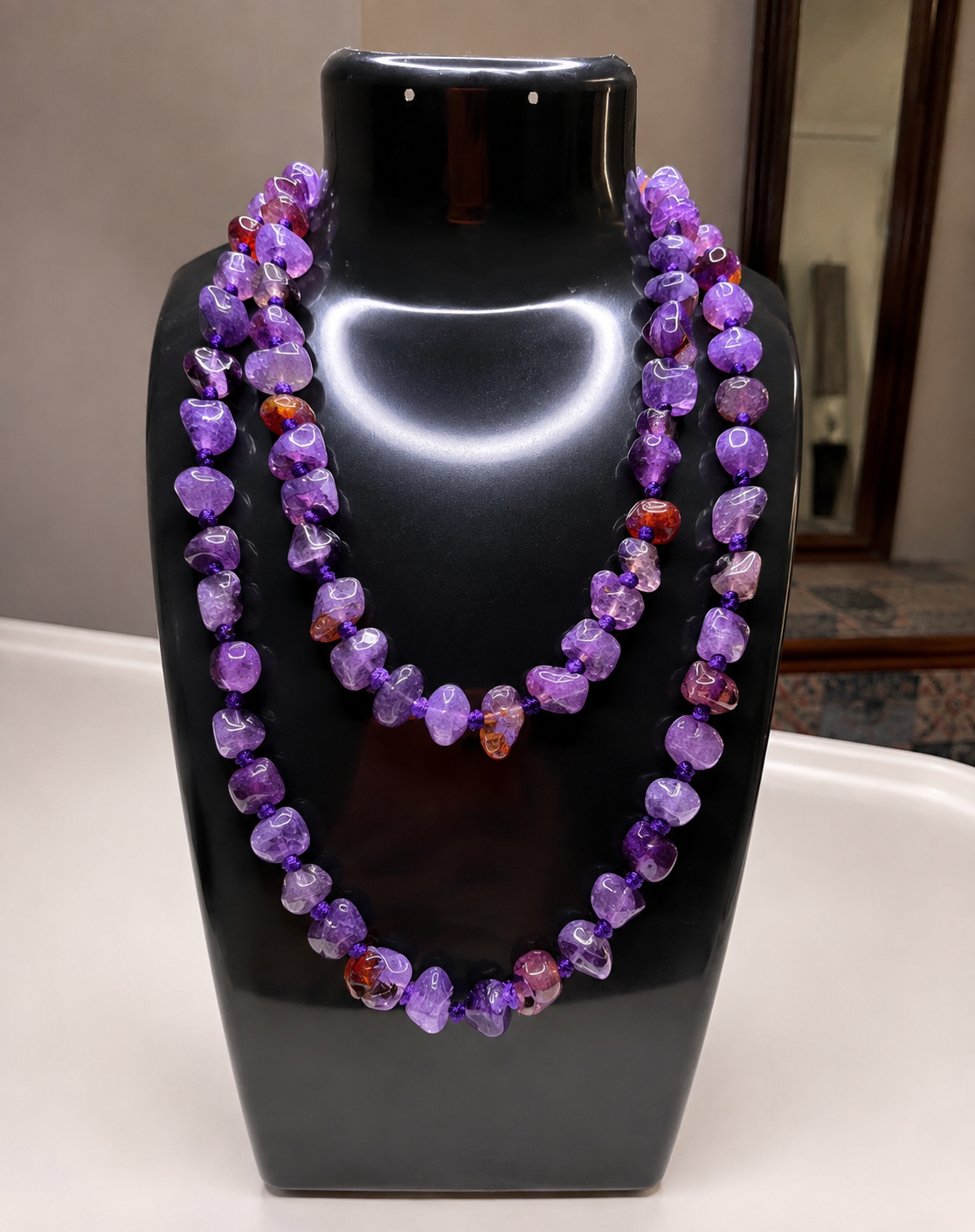 Multi-strand beaded stone necklace by Belumiee, showcasing colorful stone beads in a contemporary jewelry style.