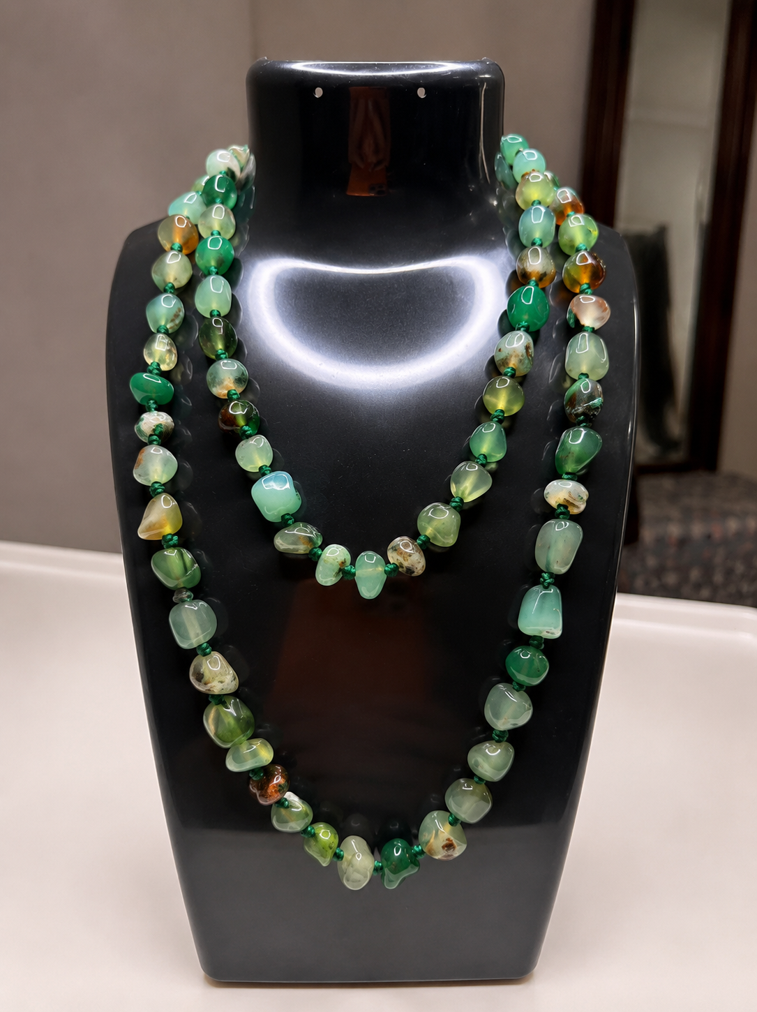 Multi-strand beaded stone necklace from Belumiee, featuring contemporary jewelry design with colorful stone beads.