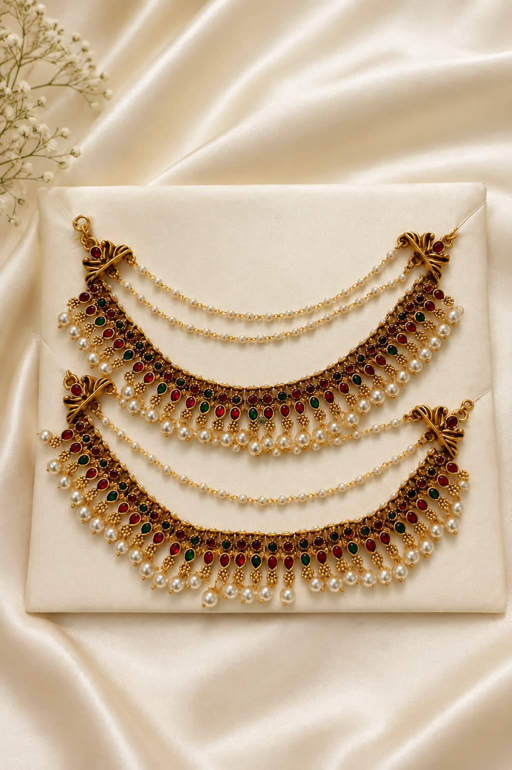 Elegant pearl ear chain by Belumiee featuring a royal temple design, displayed on a white background with intricate details.