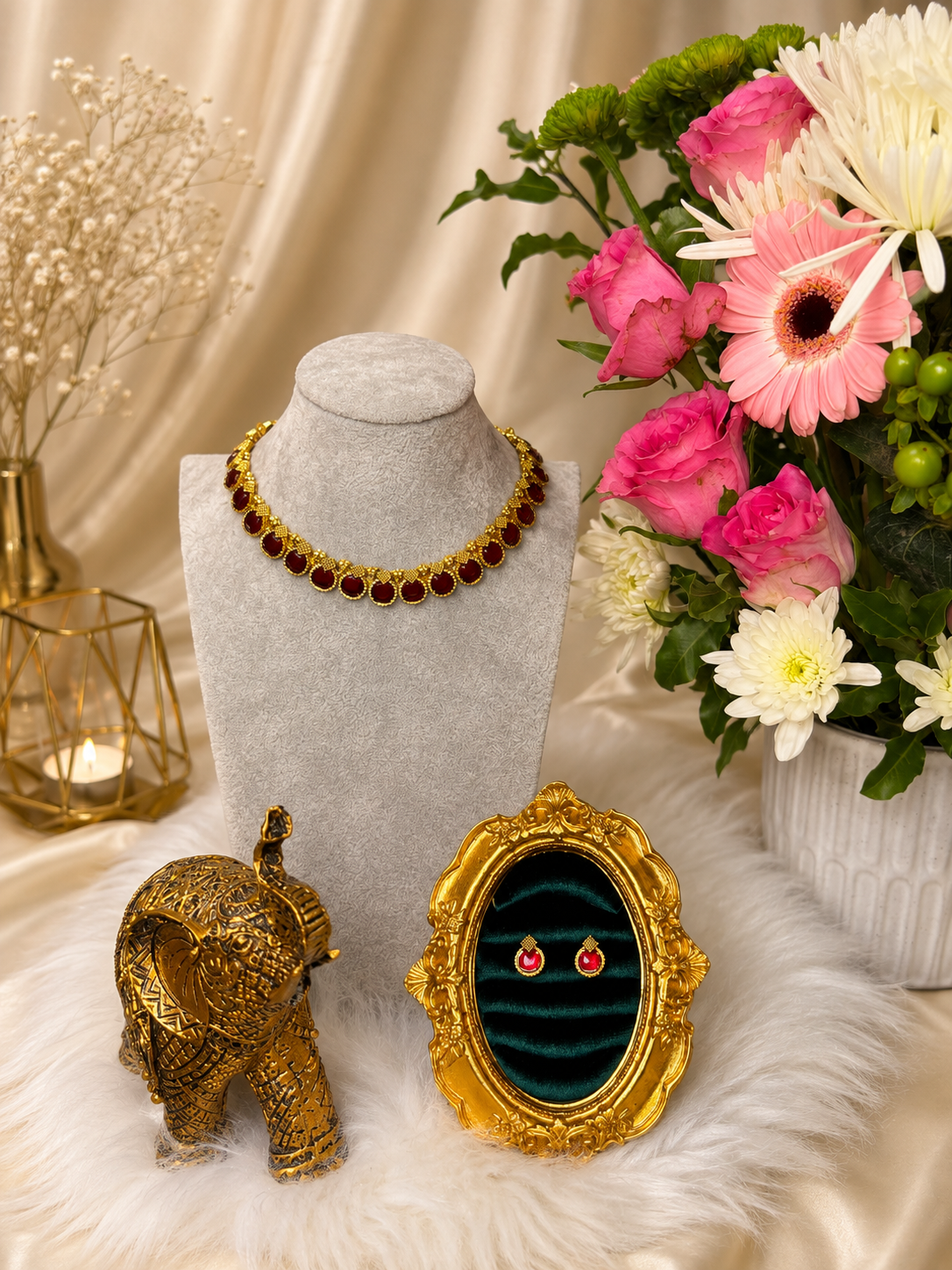 Traditional ruby oval necklace set with matching earrings in gold-tone metal, featuring intricate design and gemstone accents.