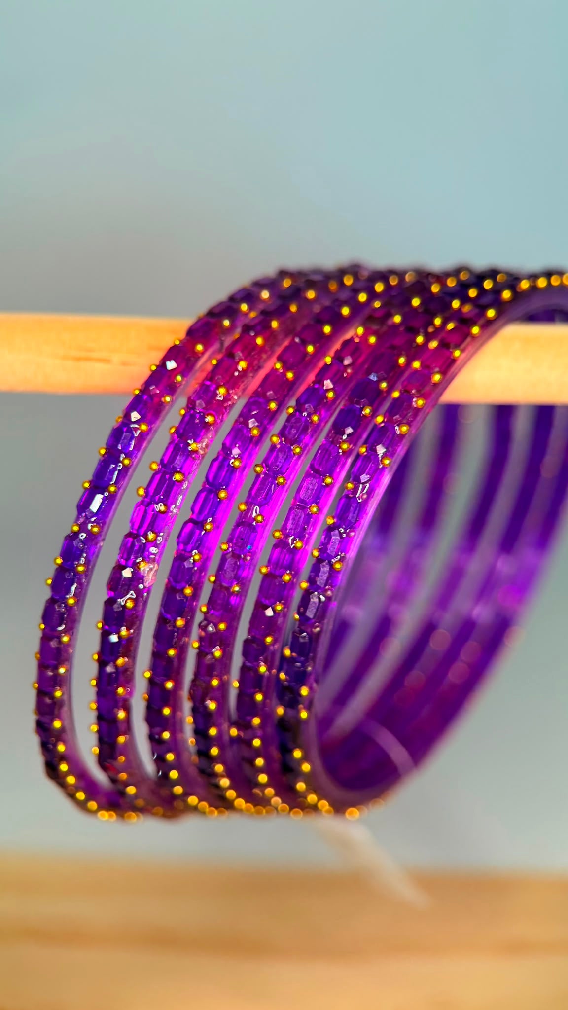 Belumiee Navrang Sparkle glass bangle set featuring purple amethyst-colored bangles with sparkling accents.