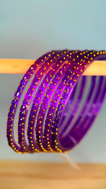 Belumiee Navrang Sparkle glass bangle set featuring purple amethyst-colored bangles with sparkling accents.