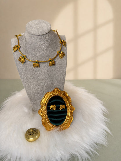 Antique elephant charm necklace and earrings set by Belumiee featuring traditional jewelry with intricate details and vintage style.