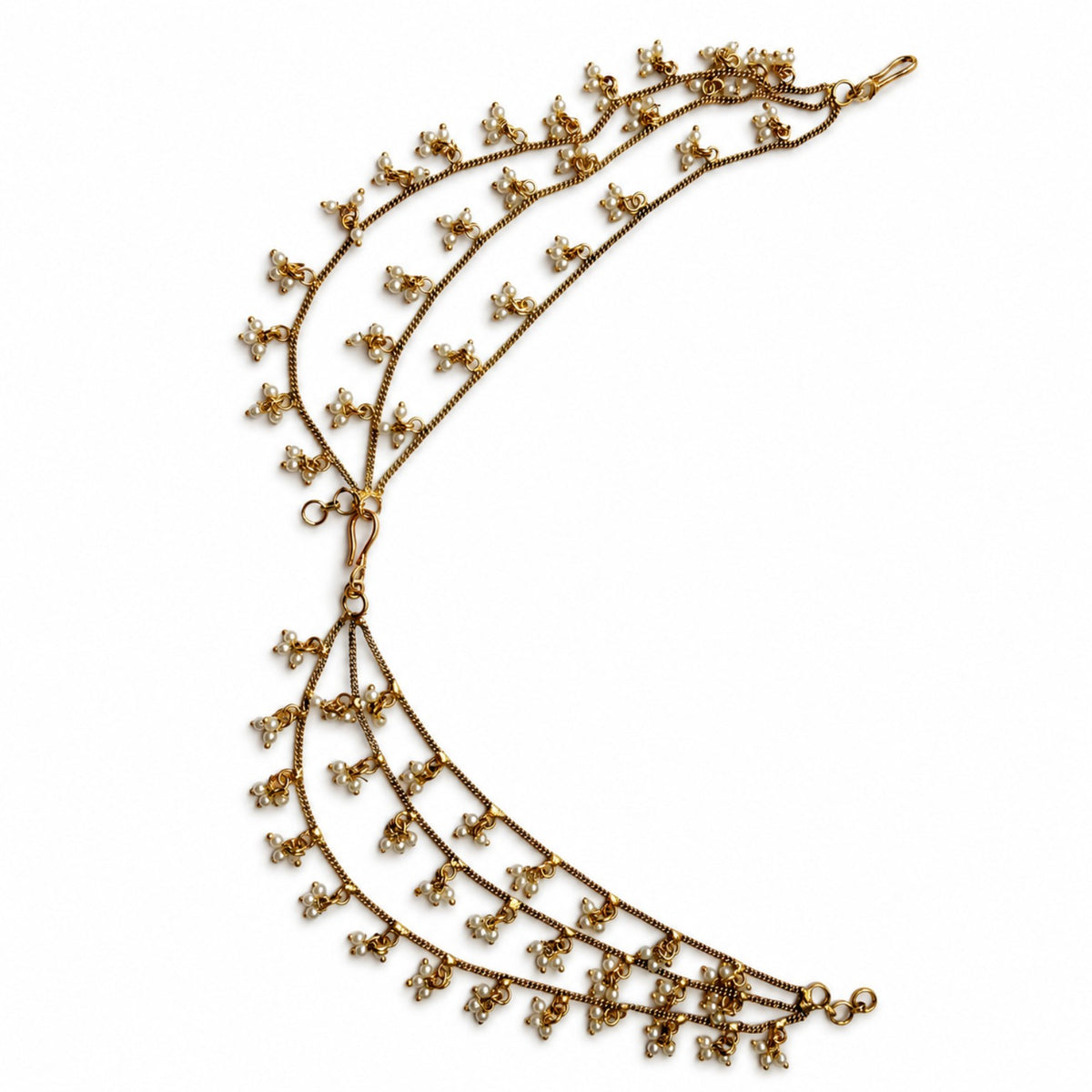 Detailed view of antique gold triple-layer pearl cluster ear chains