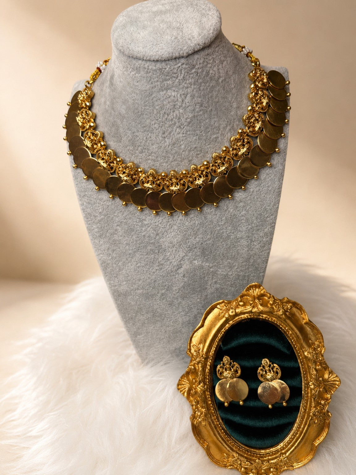 Antique Lakshmi Kasu coin necklace set by Belumiee featuring traditional gold-toned jewelry with intricate Lakshmi motifs.