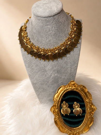 Antique Lakshmi Kasu coin necklace set by Belumiee featuring traditional gold-toned jewelry with intricate Lakshmi motifs.