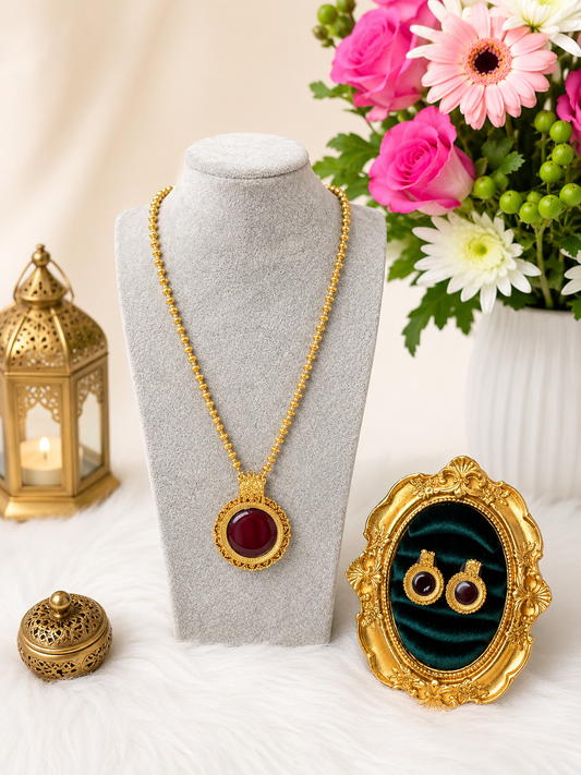 Antique Ruby round pendant necklace set with traditional design, featuring intricate craftsmanship and matching earrings.