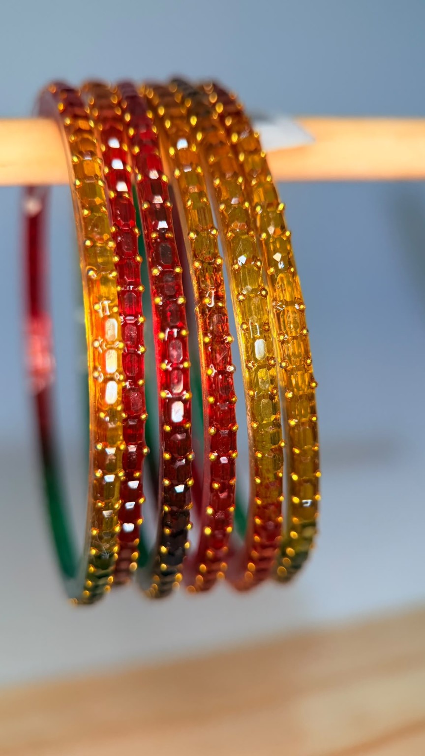 Belumiee Navrang Sparkle glass bangles set with shimmering autumn glow design, perfect for festive or traditional occasions.