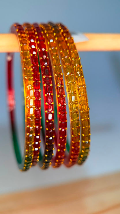 Belumiee Navrang Sparkle glass bangles set with shimmering autumn glow design, perfect for festive or traditional occasions.