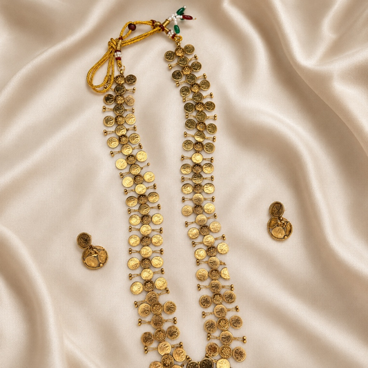 Antique gold coin layered long haram necklace and matching earrings set by Belumiee, featuring intricate coin designs and elegant craftsmanship.