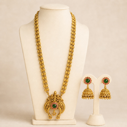 Antique gold temple pendant long necklace and jhumka earrings set with green ruby accents, traditional Indian jewelry by Belumiee.
