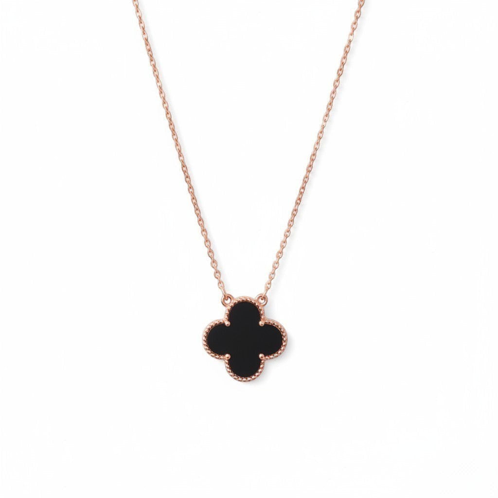 Belumiee clover pendant necklace in rose gold with black enamel inlay on a delicate sterling silver chain.