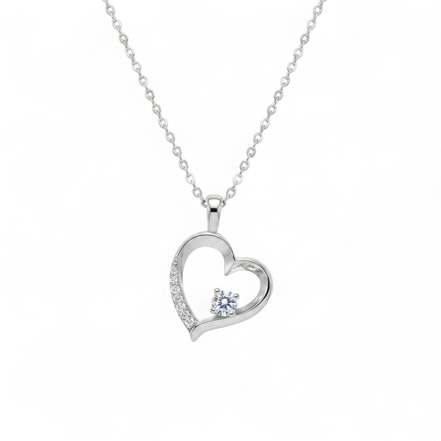 Belumiee sterling silver heart pendant necklace with a sparkling CZ stone and delicate chain on a white background.