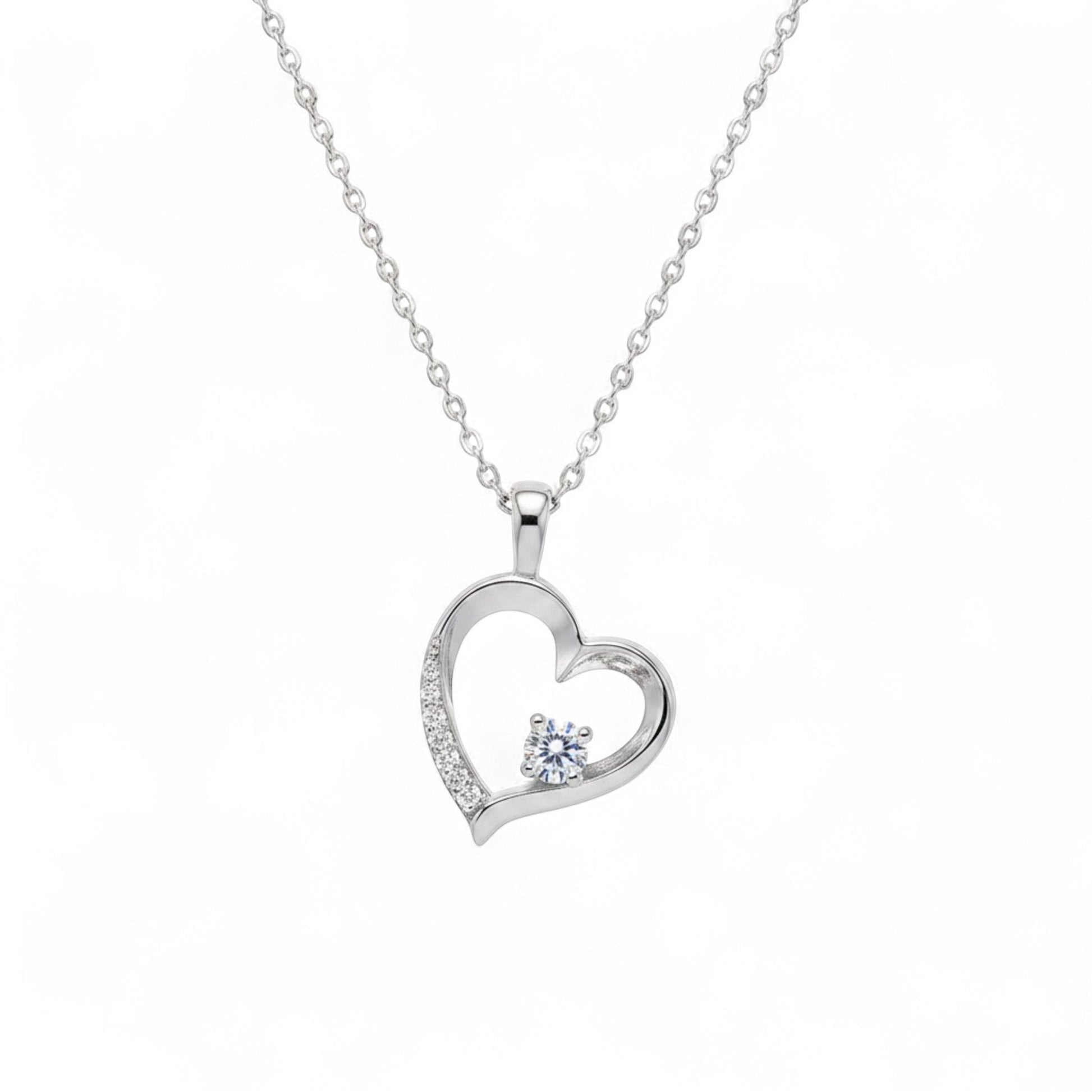 Belumiee sterling silver heart pendant necklace with a sparkling CZ stone and delicate chain on a white background.