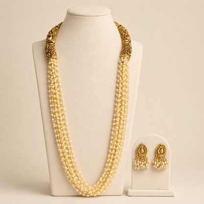 Antique gold and ivory multi-strand pearl-style long Haram necklace set with intricate design and elegant appearance.