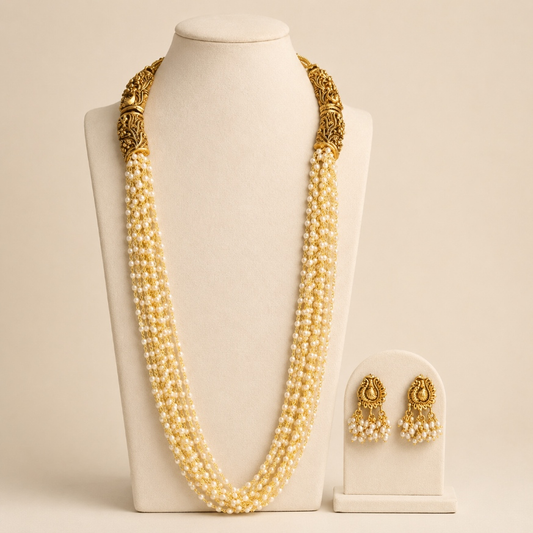 Antique gold and ivory multi-strand pearl-style long Haram necklace set with intricate design and elegant appearance.