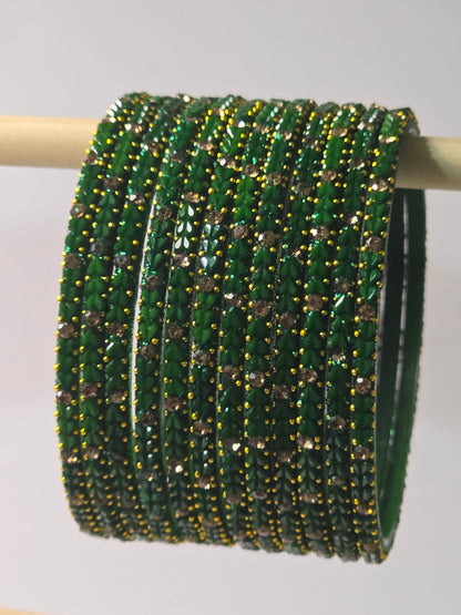 Green Protima glass bangles with raised leaf and stone detailing