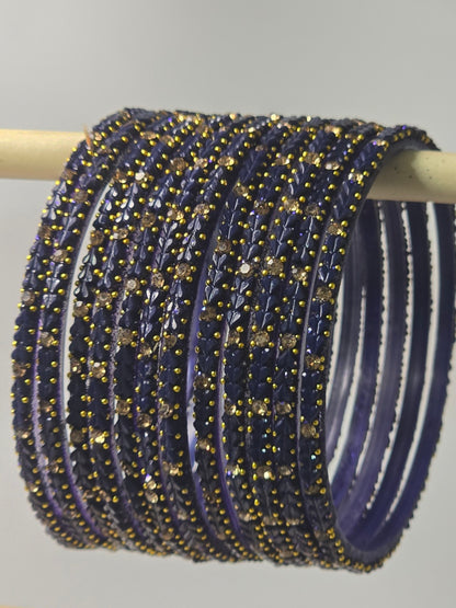 Montana blue-violet Protima glass bangles with raised leaf and stone detailing