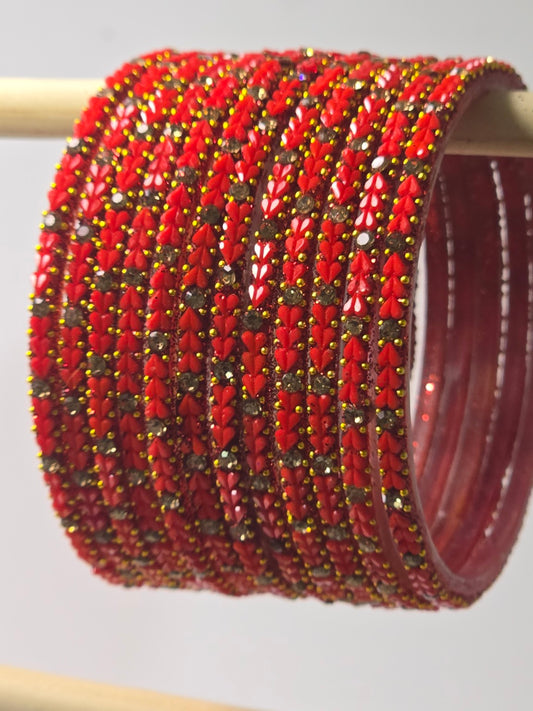 Tomato red Protima glass bangles with raised leaf and stone detailing