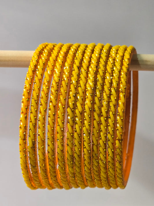 Mango yellow Ratna twisted glass bangles with gold-dot detailing