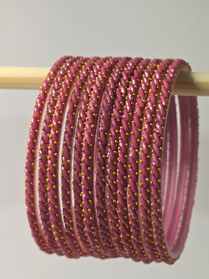 Onion dusty-pink Ratna twisted glass bangles with gold-dot detailing