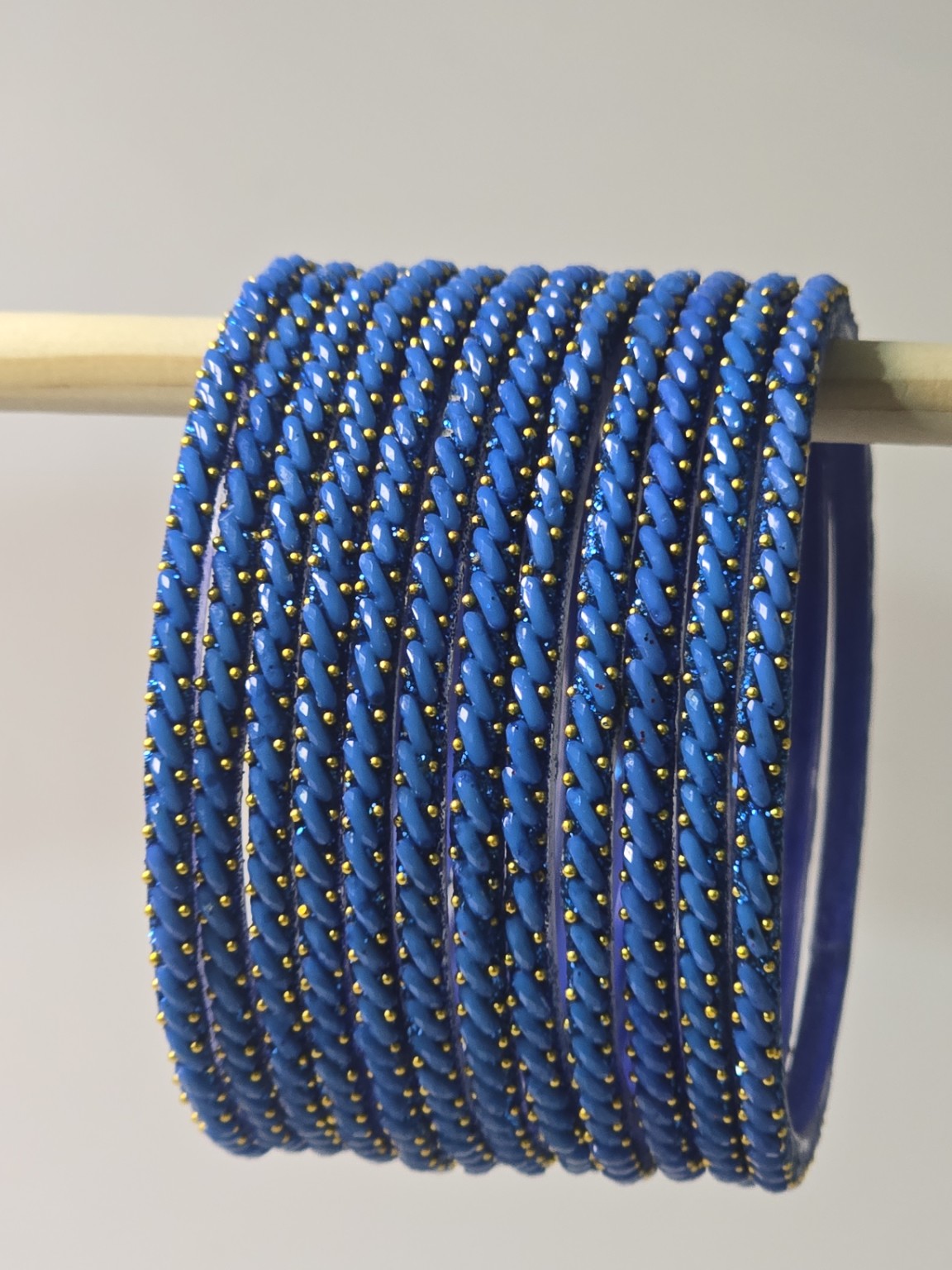 Turquoise blue Ratna twisted glass bangles with gold-dot detailing