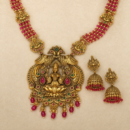 Ruby beaded Lakshmi temple long necklace and jhumka set by Belumiee, featuring intricate design and traditional Indian jewelry style.