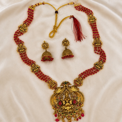 Ruby beaded Lakshmi temple long necklace and jhumka set by Belumiee, featuring intricate traditional jewelry with vibrant red beads.