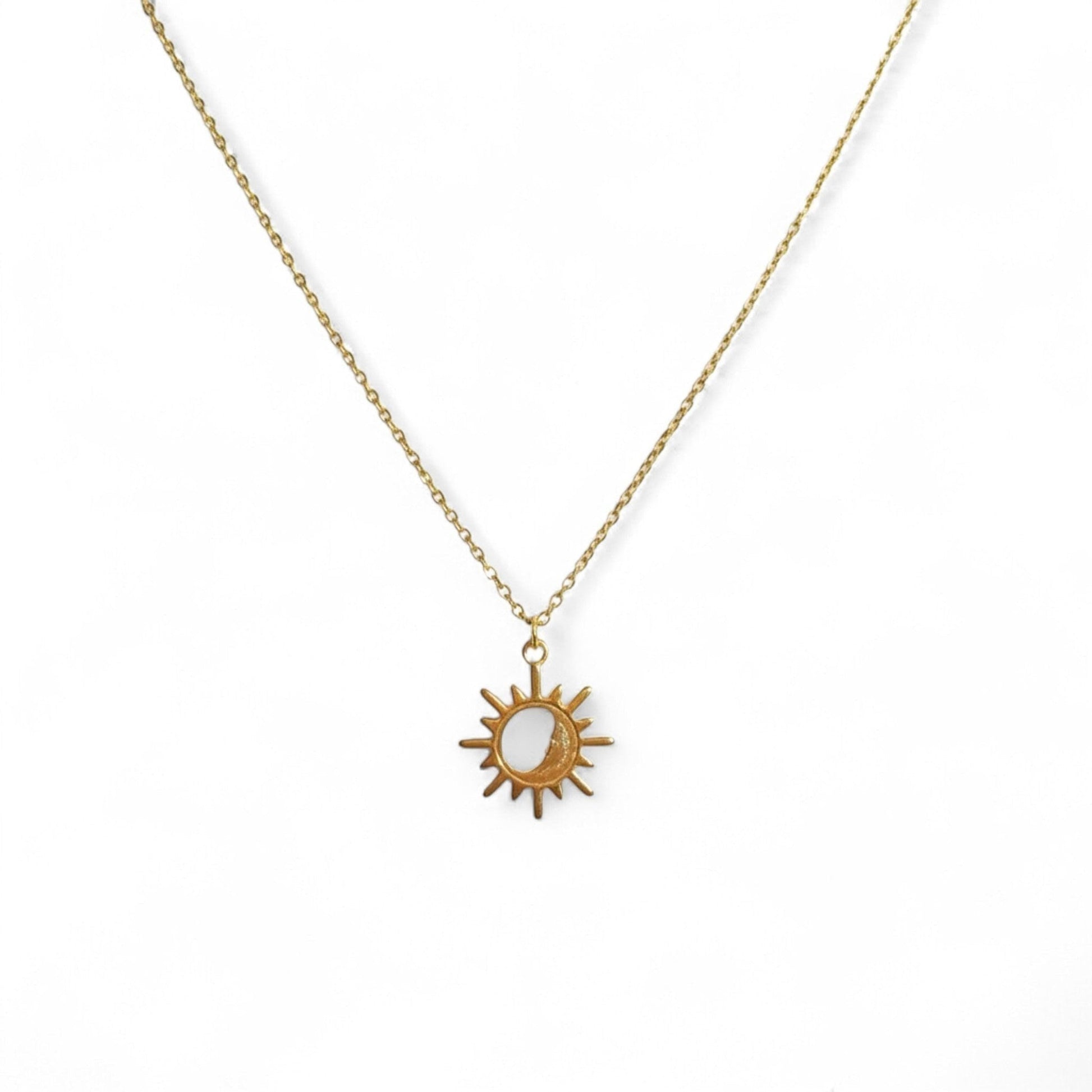 Sterling silver sun pendant necklace by Belumiee, featuring a detailed sun design on a delicate chain in silver and gold tones.