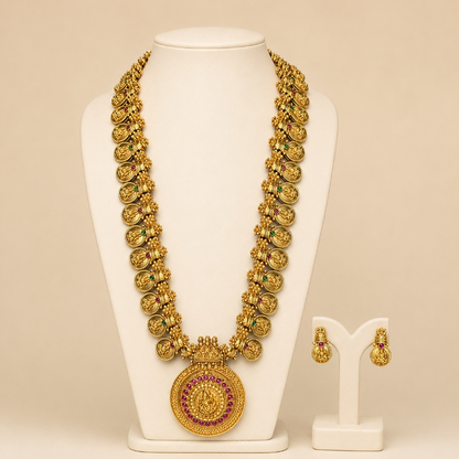 Antique gold temple coin long necklace and earrings set with intricate detailing, traditional jewelry by Belumiee.