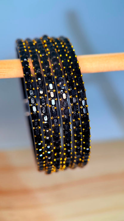 Black Navrang Sparkle Glass Bangles Set by Belumiee, featuring shiny glass bangles with intricate designs for traditional wear.