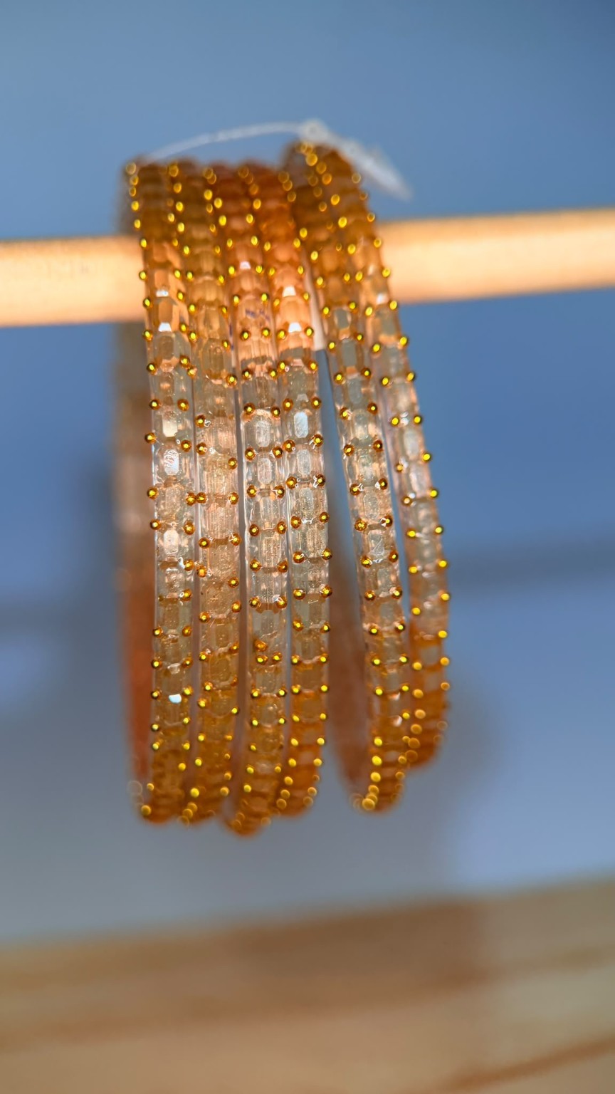 Champagne gold Navrang Sparkle glass bangles set by Belumiee, featuring shimmering, decorative bangles for traditional Indian jewelry.
