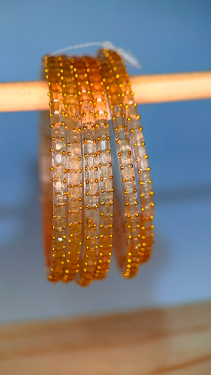 Champagne gold Navrang Sparkle glass bangles set by Belumiee, featuring shimmering, decorative bangles for traditional Indian jewelry.