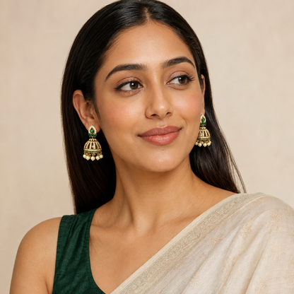 Model wearing Emerald Green crystal cage jhumka earrings with pearl-style drops