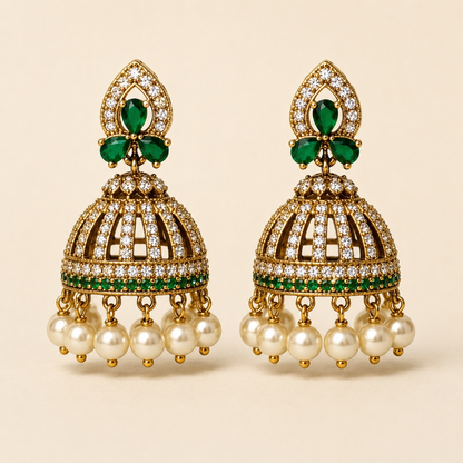 Gold-tone crystal cage jhumka earrings in Emerald Green with pearl-style drops
